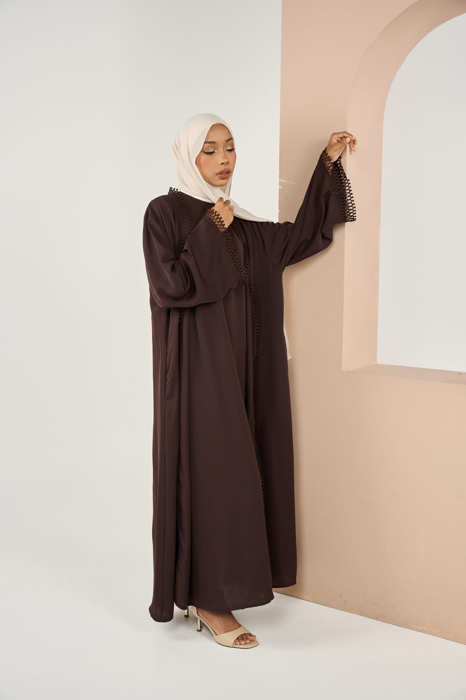 Torexia model wearing a Coffee daily abaya